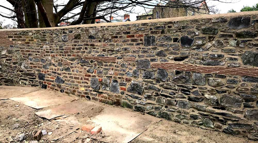 18th-century-stone-wall-restored-by-PMAC-full brick restoration