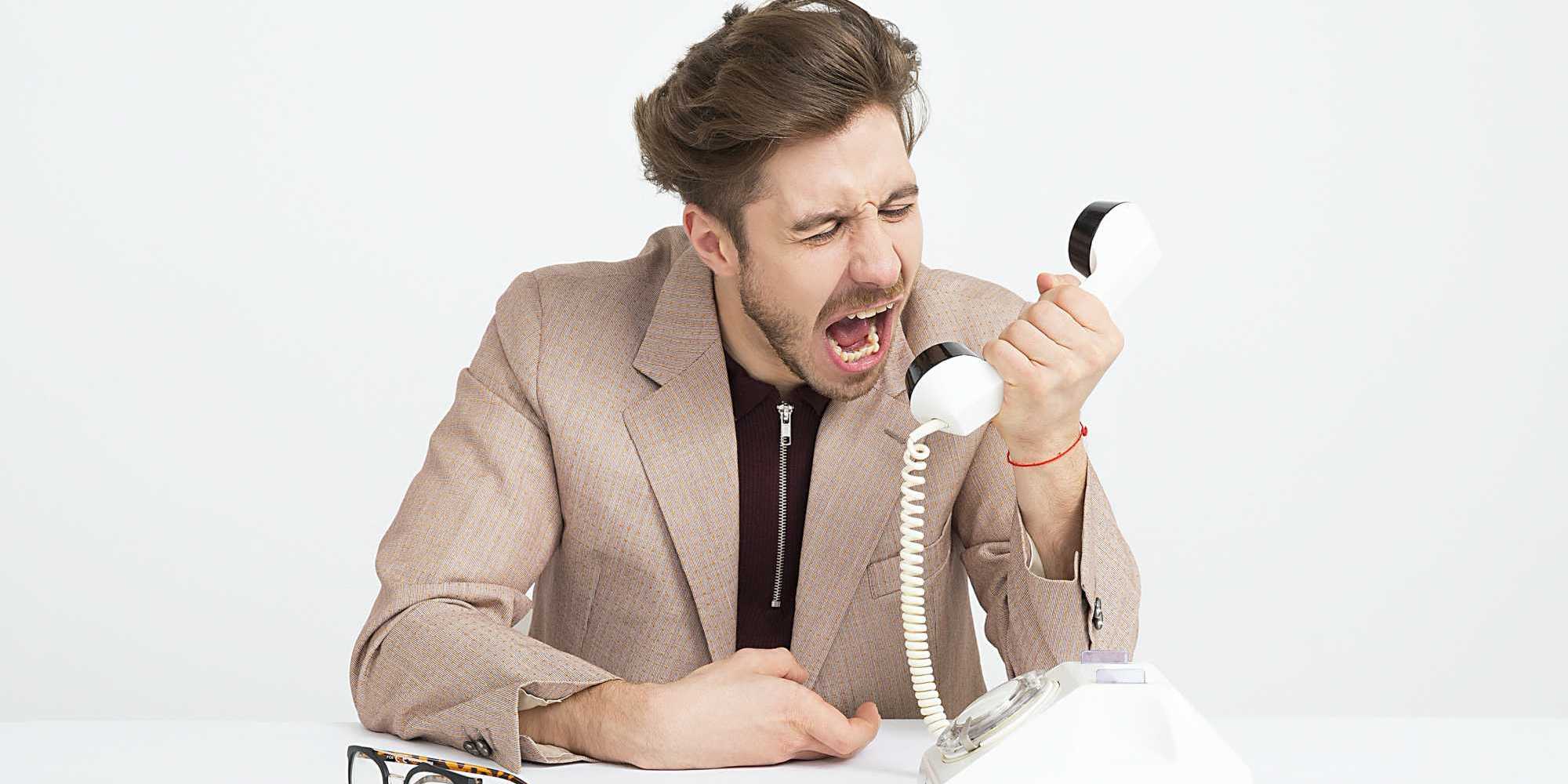 Man shouting down the phone