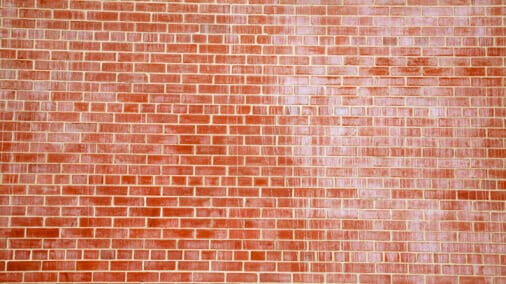 Close up of efflorescence on red bricks