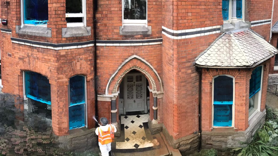Thumbnail image of red brick house getting cleaned