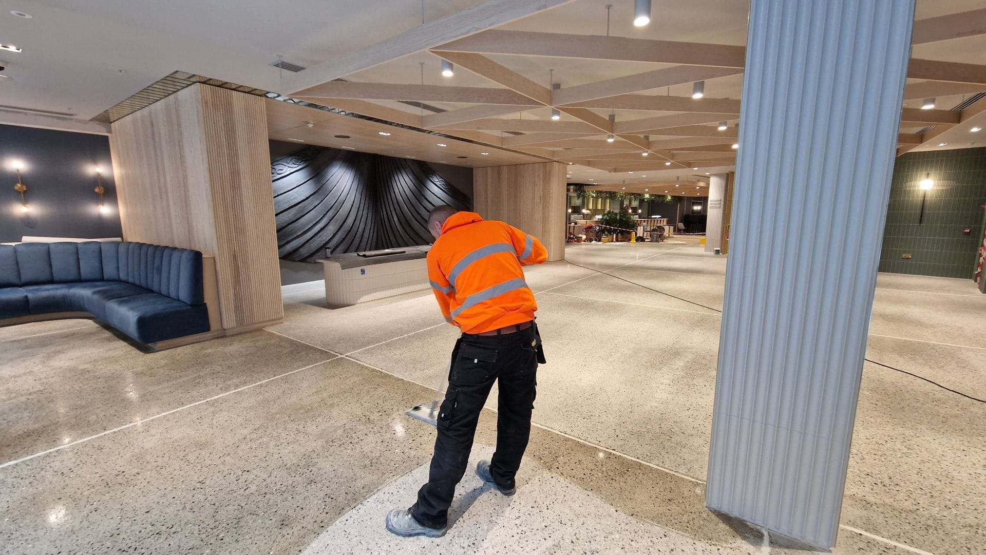 PMAC operative cleaning and sealing a polished concrete floor