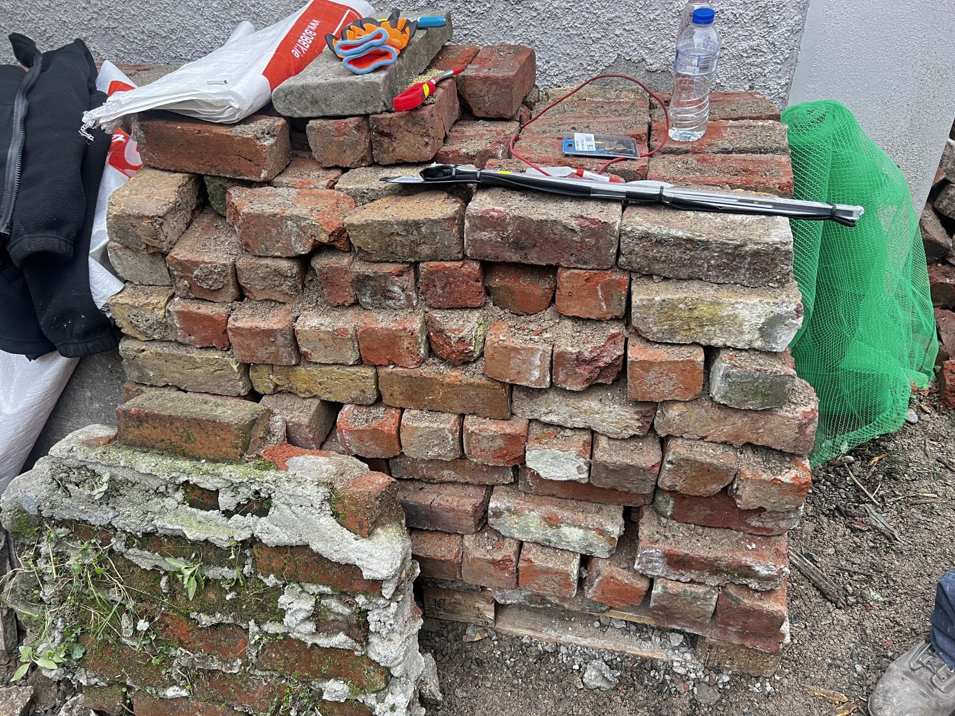 Salvaged Bricks to be recycled into the restored wall Salvaged Bricks to be recycled into the restored wall