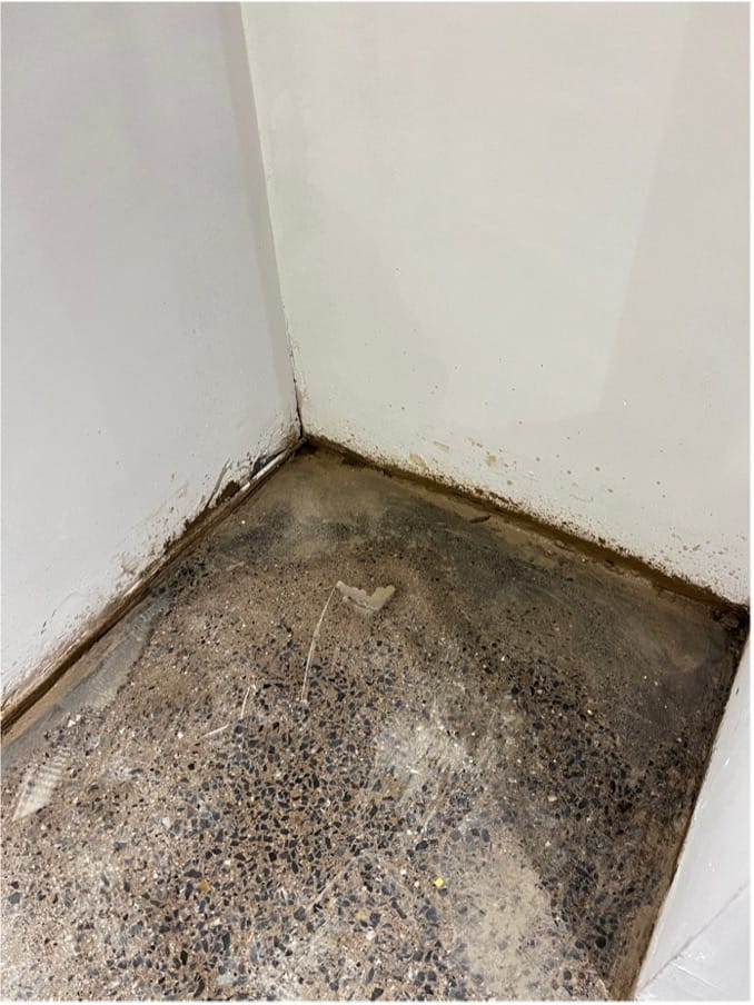 Corners smoothed out on a badly poured concrete floor. 3 Corners smoothed out on a badly poured concrete floor.